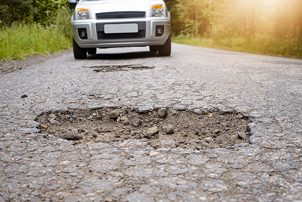 How To Know If Your Wheels Are Bent After Hitting a Pothole or Just Need Balancing